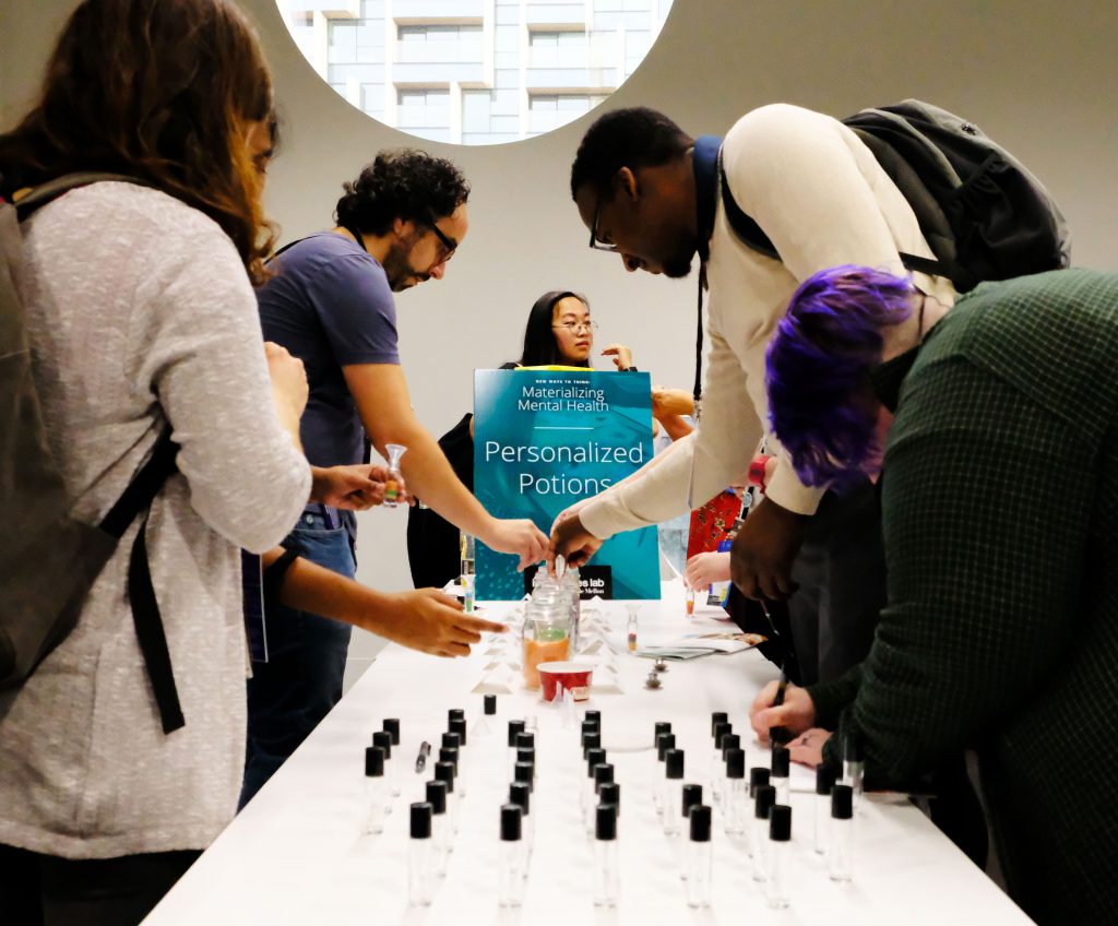 MozFest 2019 visitors make their personalised potions, facilitated by Jen Brown. Photo by Ulu Mills